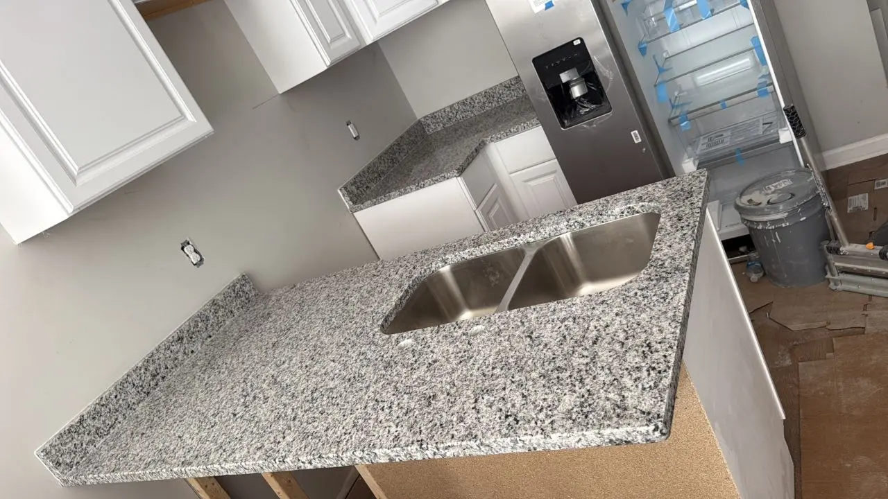 Speckled granite countertop with double-bowl undermount sink